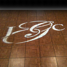 Couple's monogram projected on the dance floor